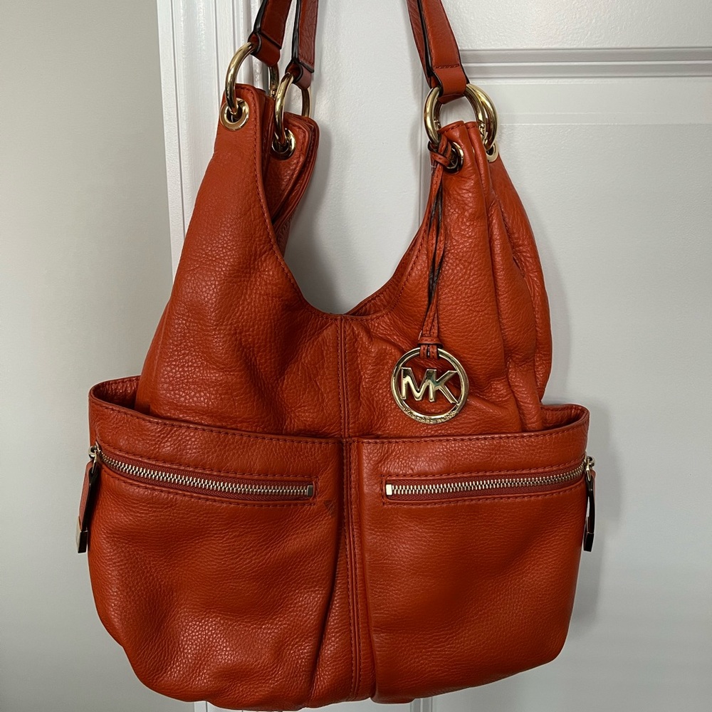 Michael Kors orange leather hobo purse